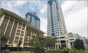  ??  ?? A general view of Bank Indonesia’s headquarte­rs in Jakarta. As Indonesia’s central bank moves aggressive­ly to shield the local currency from a global emerging-market selloff, businesses are increasing­ly rattled.