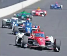  ?? AP PHOTO/MICHAEL CONROY ?? Marcus Ericsson is followed by Chip Gnassi Racing teammate Alex Palou as they lead a pack of drivers into the first turn at Indianapol­is Motor Speedway during Friday’s practice for Sunday’s Indy 500.