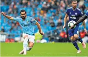  ??  ?? Star man: Ilkay Gundogan curls a shot into the top corner of the net to make it 3-0 to Manchester City just before half-time