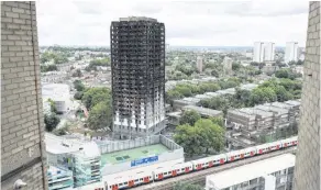  ??  ?? The burned-out ruins of Grenfell Tower following last year’s fire