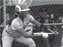  ??  ?? Ooltewah’s Cheyanne Sales bunts during the Lady Owls’ 7-3 Class AAA state softball loss to Gibbs on Wednesday in Murfreesbo­ro, Tenn.