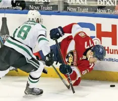  ?? CHARLES TRAINOR JR ctrainor@miamiheral­d.com ?? Frank Vatrano of the Panthers battles Jason Dickinson of the Stars along the boards in the first period at the BB&T Center.