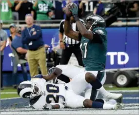  ?? THE ASSOCIATED PRESS ?? Philadelph­ia Eagles wide receiver Alshon Jeffery catches a touchdown pass over Los Angeles Rams free safety Lamarcus Joyner during the second half of Sunday’s game in Los Angeles.