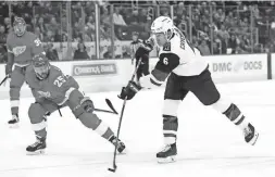  ??  ?? Coyotes defenseman Jakob Chychrun (6) shoots as Red Wings defenseman Mike Green (25) on Tuesday in Detroit.