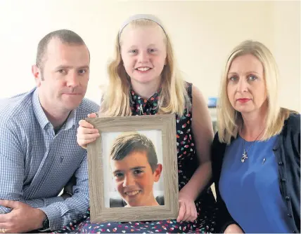  ??  ?? > Beth and Stuart Baldwin, together with their daughter 11-year-old Lia, have raised almost £70,000 for charity since their son Peter died in January 2015