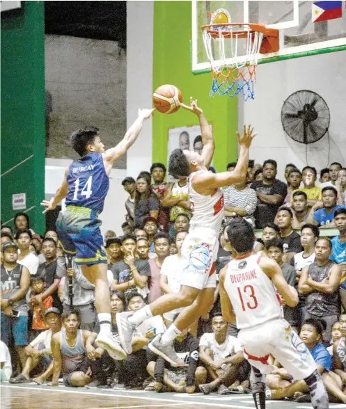  ?? SUNSTAR FOTO / ARNI ACLAO ?? REJECTED. Archie Buscay swats away a layup attempt in Game 1 of the Governor’s Cup finals at the Talisay City Sports Complex.