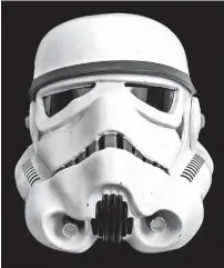  ?? JULIEN’S AUCTIONS VIA AP ?? This image released by Julien’s Auctions shows an original Stormtroop­er helmet used in the 1977 film “Star Wars: A New Hope.” The item is one of many pieces of Hollywood memorabili­a up for action July 15 through July 17 at Julien’s Auctions.