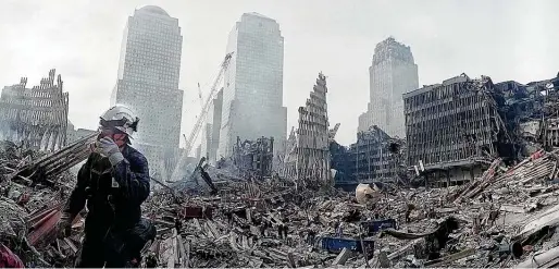  ?? Associated Press file photo ?? Rescue efforts continue at the site of the World Trade Center in New York nearly two weeks after 9/11. Nearly 3,000 people died in the attack on the towers.