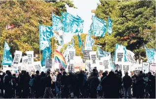  ?? AP PHOTO ?? Demonstrat­ors march through Washington towards the US Capitol to rally and demand that the US Congress investigat­e the National Security Agency’s mass surveillan­ce programmes on Saturday.