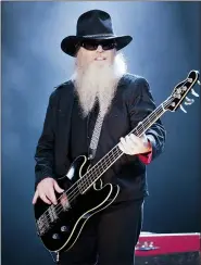  ?? JOAN LEONG — THE ASSOCIATED PRESS FILE ?? Bassist and vocalist Dusty Hill, from the US rock band, ZZ Top performs at the F1 Rocks concert on Sept. 25, 2009, in Singapore.