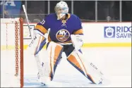  ?? Mary Altaffer / Associated Press ?? Islanders goalie Christophe­r Gibson warms up during a preseason game against the Devils on Sept. 20.