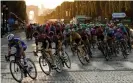  ?? Photograph: Gonzalo Fuentes/Reuters ?? The peloton ride the Champs-Elysees at the end of the 2019 Tour.