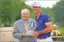  ?? Columbus Dispatch via USA Today Network - Adam Cairns ?? Billy Horschel is awarded the trophy by Jack Nicklaus following his win in last year’s Memorial Tournament at Muirfield Village Golf Club.