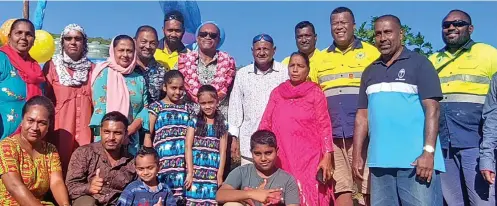  ?? ?? Acting Minister for Rural and Maritime Developmen­t (in garland), Jone Usamate, with Cawalevu Settlement residents and ministry representa­tives during the borehole water project commission­ing on June 22, 2022.