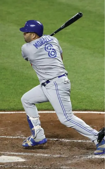  ?? PATRICK SEMANSKY/THE ASSOCIATED PRESS ?? Kendrys Morales connects on a 4-for-5 night, including three home runs, in Thursday’s Jays win in Baltimore.