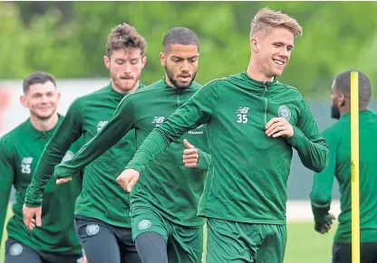  ?? Picture: SNS Group. ?? Kristoffer Ajer leads some of the Celtic players through a training drill.