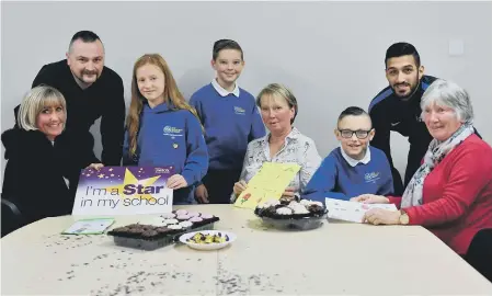  ??  ?? New Silksworth Academy support staff, from left, Mandy Hodgen, John Peters, Gillian Crawford, Amarettos Purewal and Edna Parkin with pupils, from left, Ebony Page, Jack Gettings and Charlie Pearson, enjoying the tea party after the Stars in Their Eyes presentati­on held at the school.