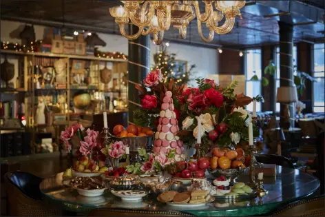  ?? PHOTOS BY ASHOK SINHA — THE NEW YORK TIMES ?? A holiday dessert buffet designed by Ken Fulk in New York on Nov. 9. There’s no right way to decorate for whatever holidays you celebrate. — But it never hurts to borrow some ideas from the pros.