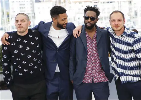  ?? Photo by Vianney Le Caer/Invision/AP ?? Actors Damien Bonnard (left), Djebril Zonga, director Ladj Ly and actor Alexis Manenti pose for photograph­ers at the photo call for the film ‘Les Miserables’ at the 72nd internatio­nal film festival, Cannes, southern France, on May 16.