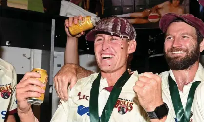  ?? Photograph: Bradley Kanaris/Getty Images ?? Marnus Labuschagn­e and Michael Neser celebrate Queensland’s Sheffield Shield final victory over New South Wales on Sunday.