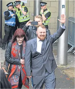  ?? Picture: SWNS. ?? Mark Meechan leaves court with his girlfriend Suzanne Kelly.