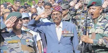  ?? SHYAM SHARMA/HT ?? Subedar Raj Singh (retd) paying tribute to his son havildar Jorabar Singh, who died in an encounter in Kupwara, at Rait village in Kangra on Friday.