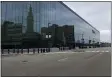  ?? DAVID S. GLASIER — THE NEWS-HERALD ?? Downtown Cleveland’s skyline is reflected on the glass facade of Rocket Mortgage FieldHouse on March 23.
