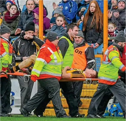  ??  ?? INTENSITY: Kilkenny manager Brian Cody (left) looks on as Pat Lyng is stretchere­d off against Waterford at Nowlan Park last weekend