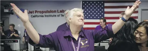  ?? JAE C. HONG / AGENCE FRANCE-PRESSE / GETTY IMAGES ?? Cassini Spacecraft Operations Team Manager Julie Webster reacts after confirmati­on of Cassini’s demise.