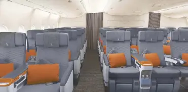  ??  ?? The Premium Economy cabin with leather seats o ers more legroom and back support, and a sixway adjustable headrest with foldable wings.