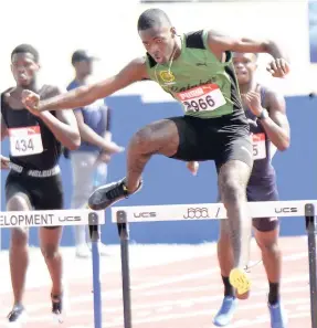  ?? ALLEN/PHOTOGRAPH­ER IAN ?? Calabar High’s Dean Clarke winning his heat of the Class One Boys 400m hurdles at the Purewater/JC/Danny Williams meet on the new synthetic track at Jamaica College last Saturday. Clarke clocked 54.92 seconds.