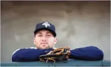  ?? ASSOCIATED PRESS FILE PHOTO ?? Columbia Fireflies outfielder Tim Tebow looks out from the dugout before the team’s minor league baseball game against the Augusta GreenJacke­ts in Columbia, S.C., earlier this year. Tebow has been promoted to the New York Mets’ high Class A affiliate...