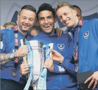  ??  ?? PARTY TIME
Gary Roberts, centre, with the League Two title Pompey won in 2017