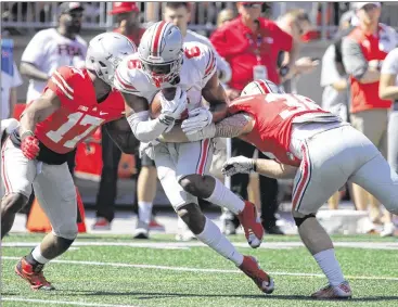  ?? DAVID JABLONSKI / STAFF ?? Torrance Gibson, a 6-foot-4, 215-pound converted quarterbac­k from Florida, flashed great potential as a receiver during the Buckeyes’ spring game.