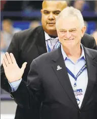  ?? Jessica Hill / Associated Press file photo ?? Denis Nayden acknowledg­es the fans before an NCAA college basketball game against UC Davis in 2013 in Hartford.