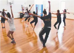  ??  ?? STEPPING UP: Students from St Monica's College take part in a dance workshop.