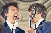  ??  ?? Shake it up, baby: Paul McCartney and George Harrison harmonize.