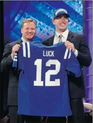  ?? SHANNON STAPLETON REUTERS ?? NFL commission­er Roger Goodell (left) with quarterbac­k Andrew Luck after he was selected by the Colts Thursday.