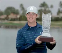  ?? AP ?? Hudson Swafford poses with the trophy after winning the CareerBuil­der Challenge golf tournament. —