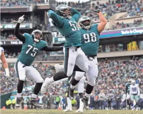  ?? BILL STREICHER/USA TODAY SPORTS ?? Steven Means (51), Vinny Curry (75) and Elijah Qualls (98) are part of the Eagles’ deep, relentless and passionate defensive line.