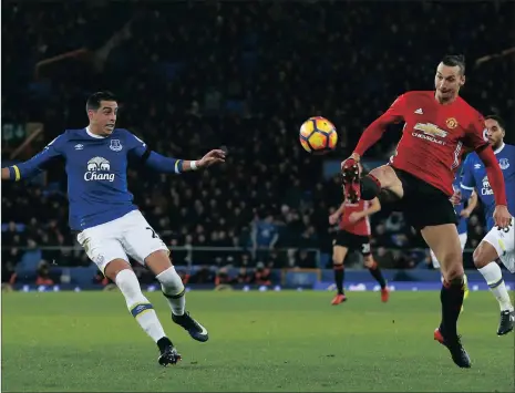  ?? Picture: ANDREW YATES, REUTERS ?? LET ZLATAN SHOW YOU HOW: Zlatan Ibrahimovi­c brilliantl­y angles a lob ball to the back of the Everton goal net at Goodison Park yesterday.