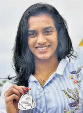  ?? PTI ?? PV Sindhu won the silver medal in world championsh­ips after losing to Japan’s Nozomi Okuhara .