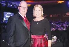  ?? NWA Democrat-Gazette/CARIN SCHOPPMEYE­R ?? Chuck and Suzy Fehlig help welcome guests to the annual Heart Ball to benefit the American Heart Associatio­n of Northwest Arkansas on Feb. 22 at the John Q. Hammons Center in Rogers.