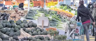  ?? PAUL CHIASSON/THE CANADIAN PRESS ?? Vegetables are on display for sale at the Jean Talon Market on Jan. 11, 2016, in Montreal.