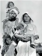  ??  ?? A Sikh family on the road to Punjab in 1947. Photograph: Margaret BourkeWhit­e/The Life Picture Collection/Getty