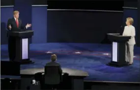  ?? THE ASSOCIATED PRESS ?? Democratic presidenti­al nominee Hillary Clinton and Republican presidenti­al nominee Donald Trump face off during the third presidenti­al debate at UNLV in Las Vegas Wednesday.