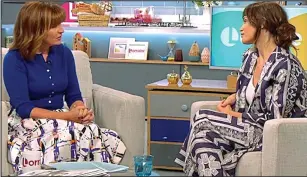  ??  ?? Stony silence: Miss Arterton stares in disbelief at Lorraine Kelly yesterday