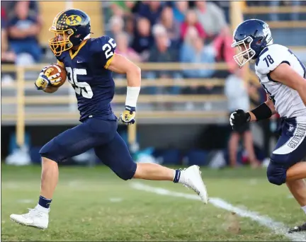  ?? DAVID C. TURBEN — FOR THE NEWS-HERALD ?? Kirtland’s Mason Rus breaks a long TD run chased by West G defensive end Nathan Meyers on Sept. 10. The Hornets won, 33-7.