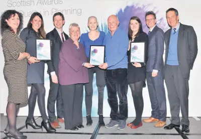  ??  ?? Celebratio­n National park planning staff with awards. Left, layout of Ripple Retreat mirrored surroundin­gs