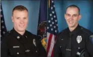  ??  ?? Officers Brandon Krissinger (left) and Raymond Sullivan